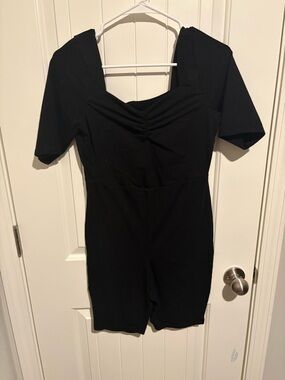 Black Short Sleeve body suit with Sweetheart Neckline and shorts.